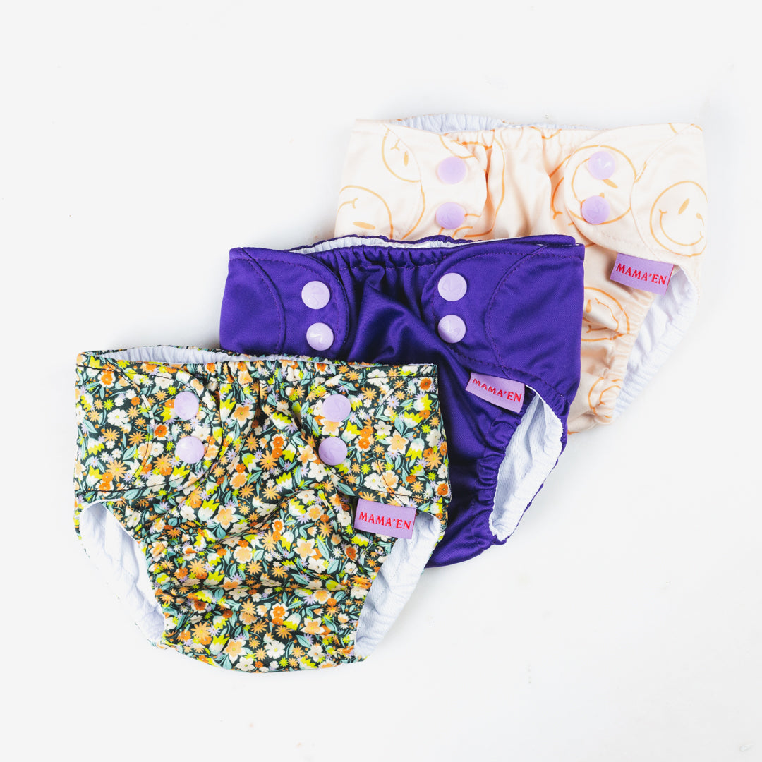 the MAMA'EN swim diapers in all three designs